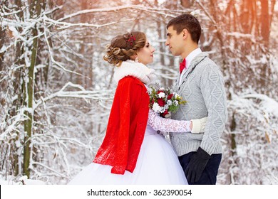 Winter Wedding. Beautiful Young Couple In The Woods.