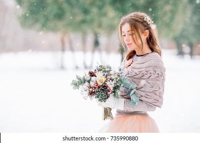 Winter Wedding Bouquet In Hands Of A Beautiful Bride.