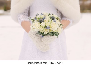 Winter Wedding Bouquet In The Hands Of The Bride