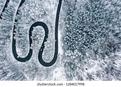 Winter Winding Road In The Forest Aerial View From A Drone