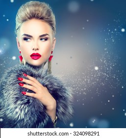 Winter Woman In Luxury Fur Coat. Beauty Fashion Model Girl In Blue Fox Fur Coat. Perfect Makeup And Accessories. Beautiful Luxury Winter Lady