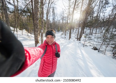 Winter Woman Selfie Phone Photo On Outdoors Hiking Adventure In Snow Covered Winter Forest. Asian Active Girl Smiling Happy Live Healthy Active Lifestyle Snowshoeing Wearing Winter Clothing.