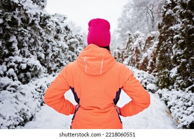 Winter Workout, Exercising In Cold Weather. Winter Fitness, Safety Tips For Exercising Outdoors. Sporty Woman In Sportswear Standing In Winter Snowy Park, Forest.