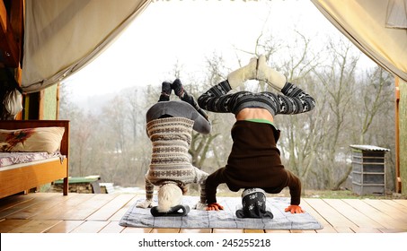 Winter Yoga On The Porch Of A Country House.