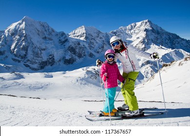 Winter,ski, Snow And Sun - Family Enjoying Winter Vacation