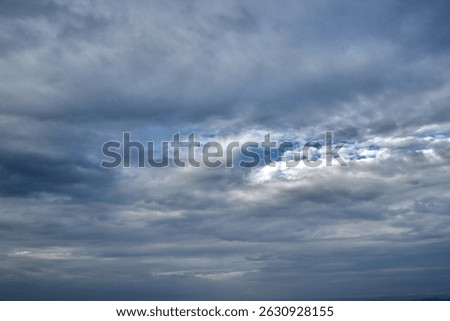 A wintry heavy rainy clouds sky