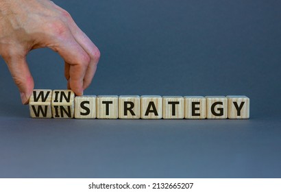 Win-win Strategy Symbol. Businessman Turns Wooden Cubes With Words Win Win Strategy. Beautiful Grey Table, Grey Background. Business, Win-win Strategy Concept. Copy Space.