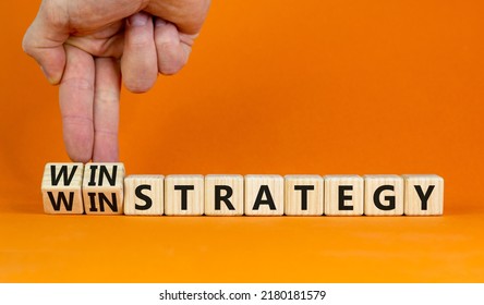 Win-win Strategy Symbol. Businessman Turns Wooden Cubes With Words Win Win Strategy. Beautiful Orange Table, Orange Background. Business, Win-win Strategy Concept. Copy Space.