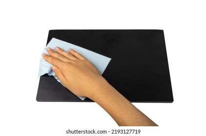 Wipe Closed Laptop Isolated. Hand Cleaning Pc With Blue Cloth, Wiping Black Notebook, Computer Care, Cleaning Device On White Background, Clipping Path