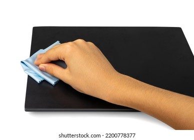 Wipe Closed Laptop Isolated. Hand Cleaning Pc With Blue Cloth, Wiping Black Notebook, Computer Care, Cleaning Device On White Background, Clipping Path