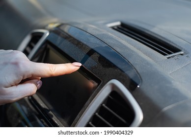 Wipe Dust Off Car Dashboard With Finger.