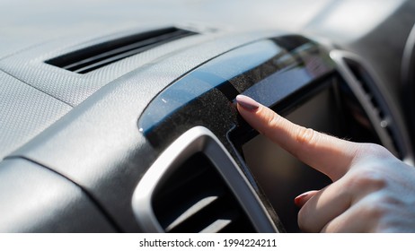 Wipe Dust Off Car Dashboard With Finger.