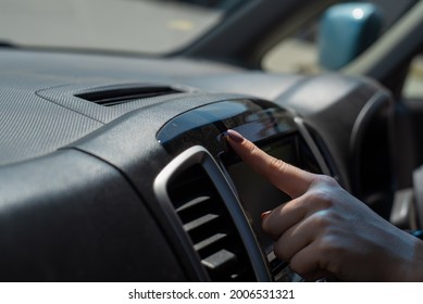 Wipe Dust Off Car Dashboard With Finger.