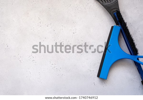 wiper blade and\
glass scraper. Glass Scrape tool or Squeegee for Shower, Window and\
Car Glass on white\
background