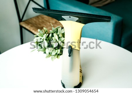 a wiper blade for Windows on a white table