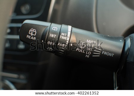 Wipers control. Modern car interior detail. adjusting speed of screen wipers in car