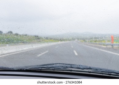 Wipers On The Windshield Of The Car In The Rain