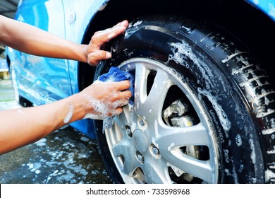 Wiping and cleaning tires When car wash - Powered by Shutterstock