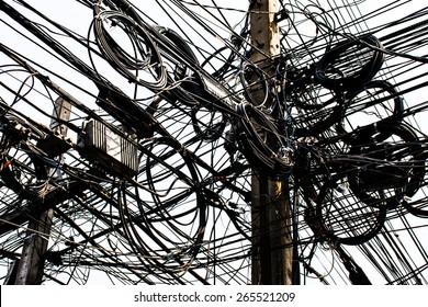 Wire assemblage a lot of cables and wires on pole in the city - Shutterstock ID 265521209