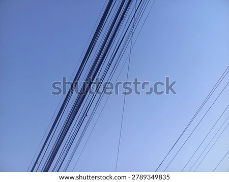 Wire assemblage a lot of cables and wires on pole. blue sky background. 