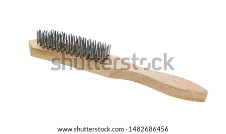 Wire brush with wooden handle on white background. Metal Brush