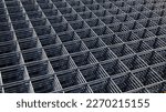 Wire mesh piles for construction. BRC welded steel wire mesh for concrete slab reinforcement of construction construction site in top view with natural light and selective focus.