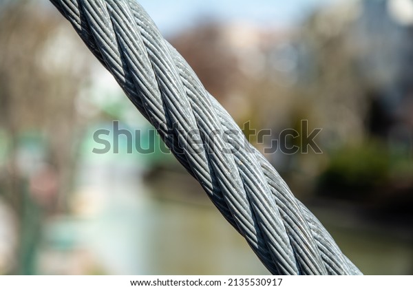 Wire rope bundle connecting bridge\
materials. Steel rope made in the form of a\
spiral.