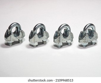 Wire Rope Clamps To Secure Wire Ropes. Wire Rope Clips On White Background. Tension Cable Assembly Accessories