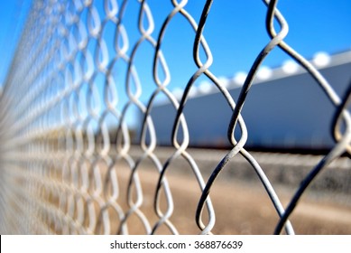 Wired fence on blue sky background