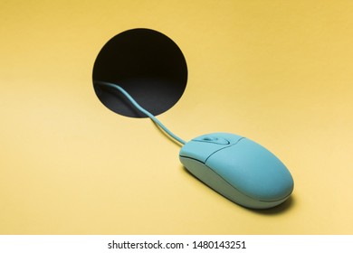Wired mouse with cable passing through hole