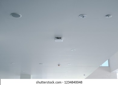 Wireless Access Point On Ceiling Of Building With Smoke Detector