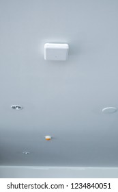 Wireless Access Point On Ceiling Of Building With Smoke Detector