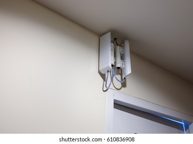 Wireless Access Point And Wall Mount On Wall Of Building