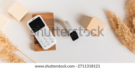 Wireless communication between a dump telephone and a fitness bracelet top view web banner
