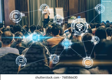 Wireless Communication Connecting Of Smart City Internet Of Things Technology Over Abstract Blurred Photo Of Conference Hall Or Seminar Room With Attendee Background, Technology With Education Concept