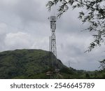 A Wireless Communication Tower Located On Hill, Mobile Tower Stock Photos, 5G Spectrum tower, 4G Spectrum Pole, Mobile Signaling Tower On Hill Top, Police Wireless System, Elaveezhapoonchira, Kerala