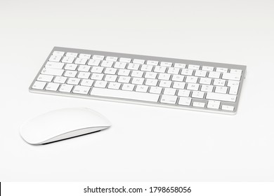 Wireless computer keyboard and mouse on white background