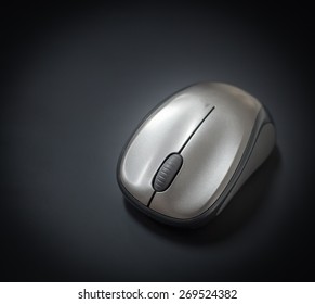 Wireless computer mouse on black background
