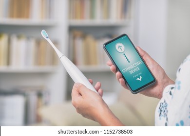 Wireless Connecting Sonic Toothbrush With Smart Phone App. Modern Home Technology Concept