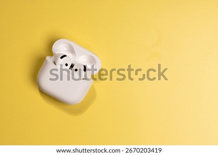 Wireless Ear Pod and Case Presentation on Yellow Surface