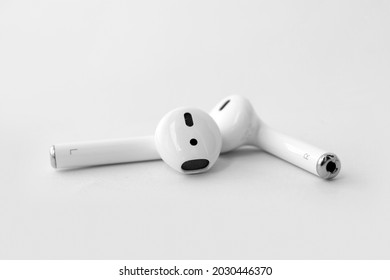 Wireless earphones or earpods isolated on white background. Technology device items, gadgets or products.