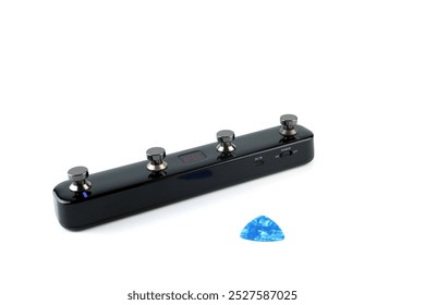 wireless electric guitar effect pedal which can create various sound effects for music such as overdrive , delay , distortion , reverb or wah wah etc. isolated on white background and a blue pick - Powered by Shutterstock