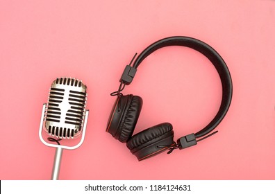 Wireless Headphone With Microphone On Pink Background, Music Concept.