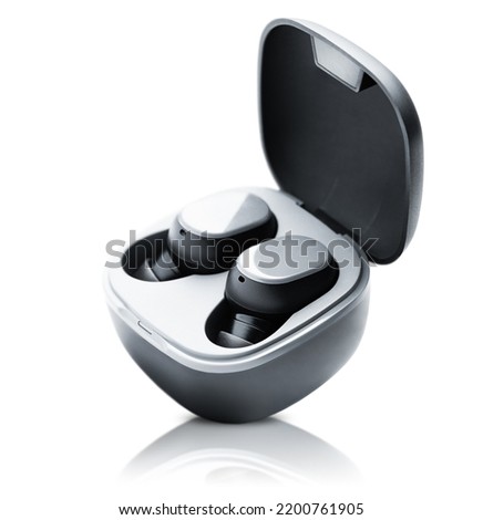 wireless headphones in a case on a white isolated background