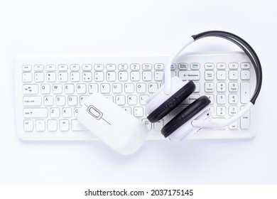 Wireless Headphones, Computer Keyboard And Mouse On White Background