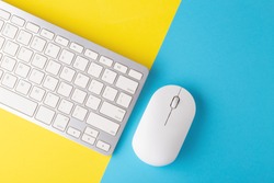 Wireless Keyboard And Mouse On Yellow Blue Background, Minimal, Flat Lay