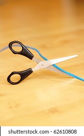 wireless lan or internet connection concept with laptop cable and scissors