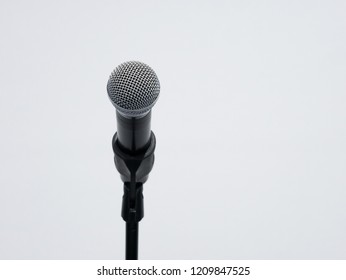 Wireless microphone on stand at white background close up