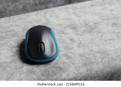 A Wireless Mouse That Is Paired With A Notebook For Ease Of Use.