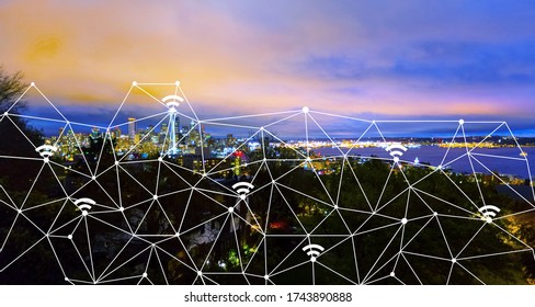 Wireless network and connection technology with city background at night - Shutterstock ID 1743890888